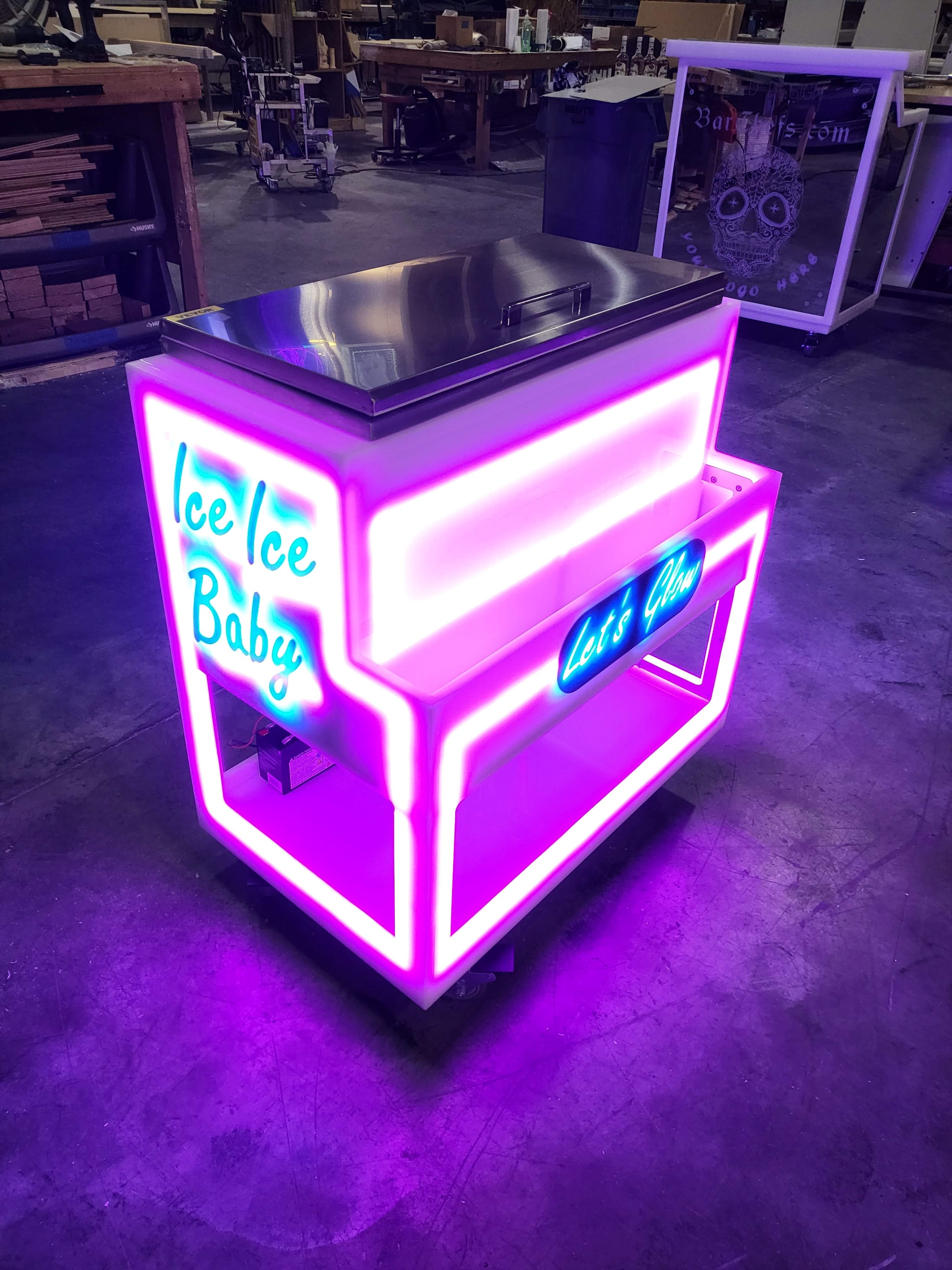 Pink and blue lighting on our rolling LED ice chest bars