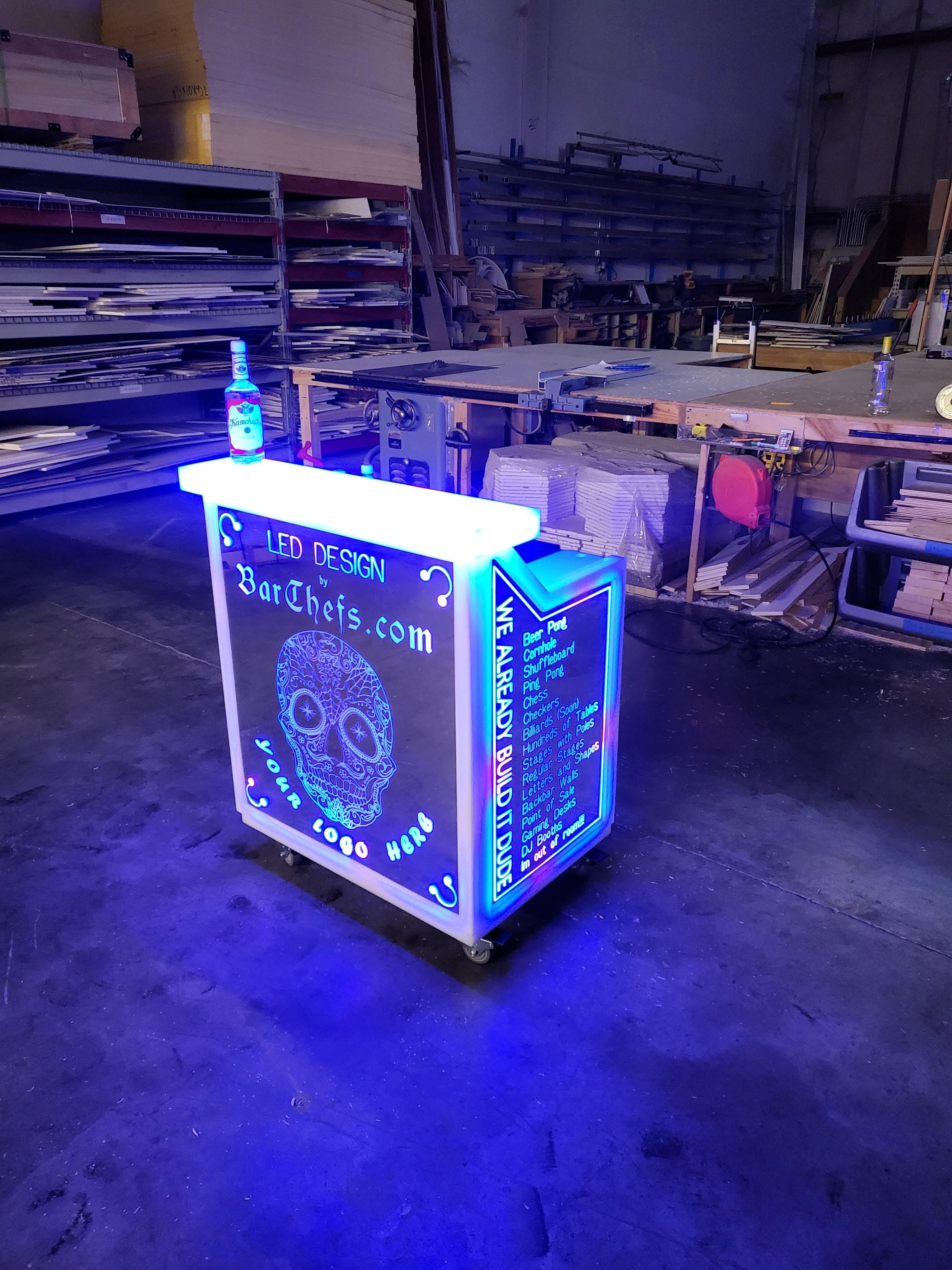 LED portable bar with etched skull on front panel and blue lights