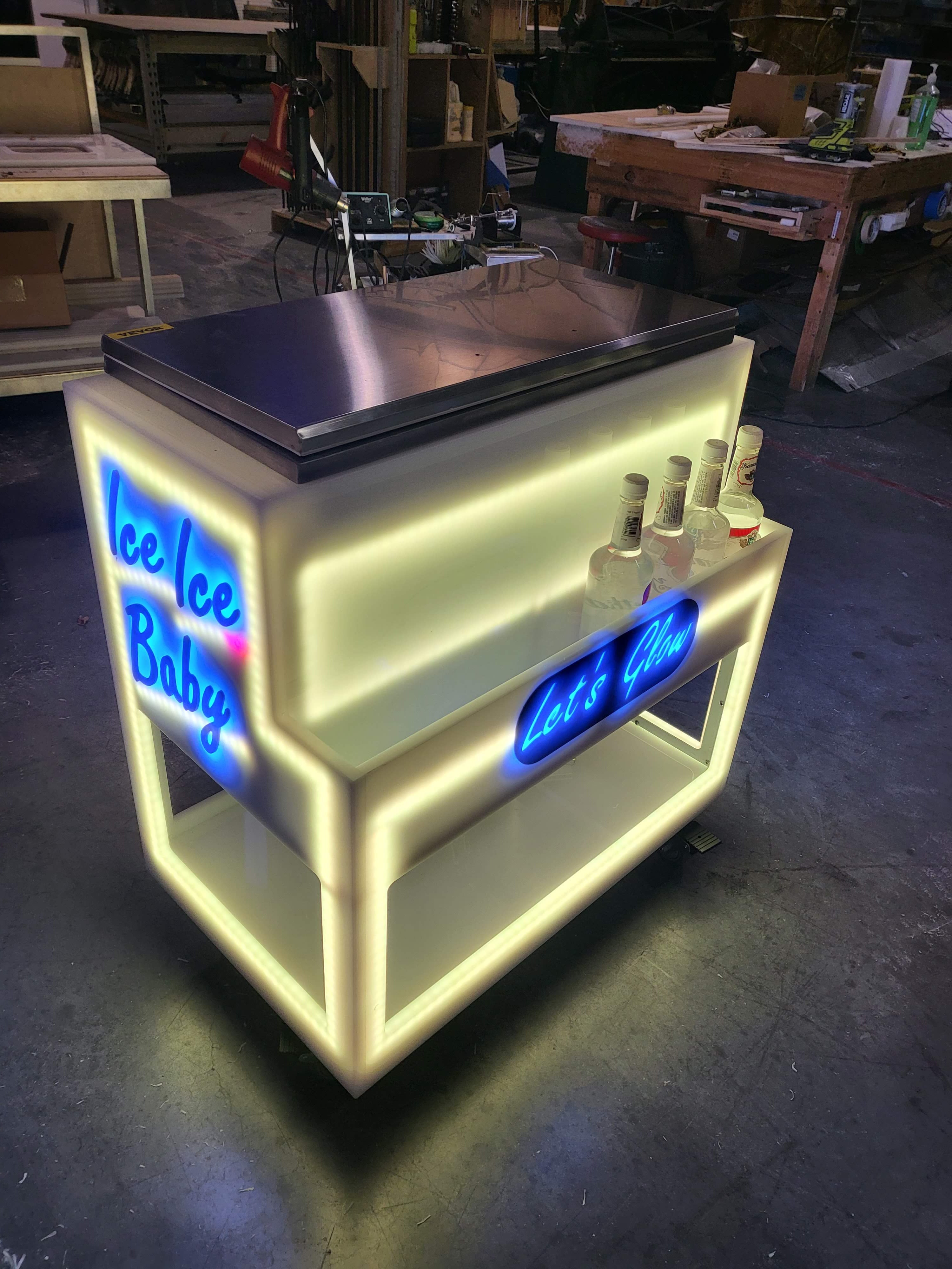 Our LED ice cooler with yellow lighting and blue graphics glowing.