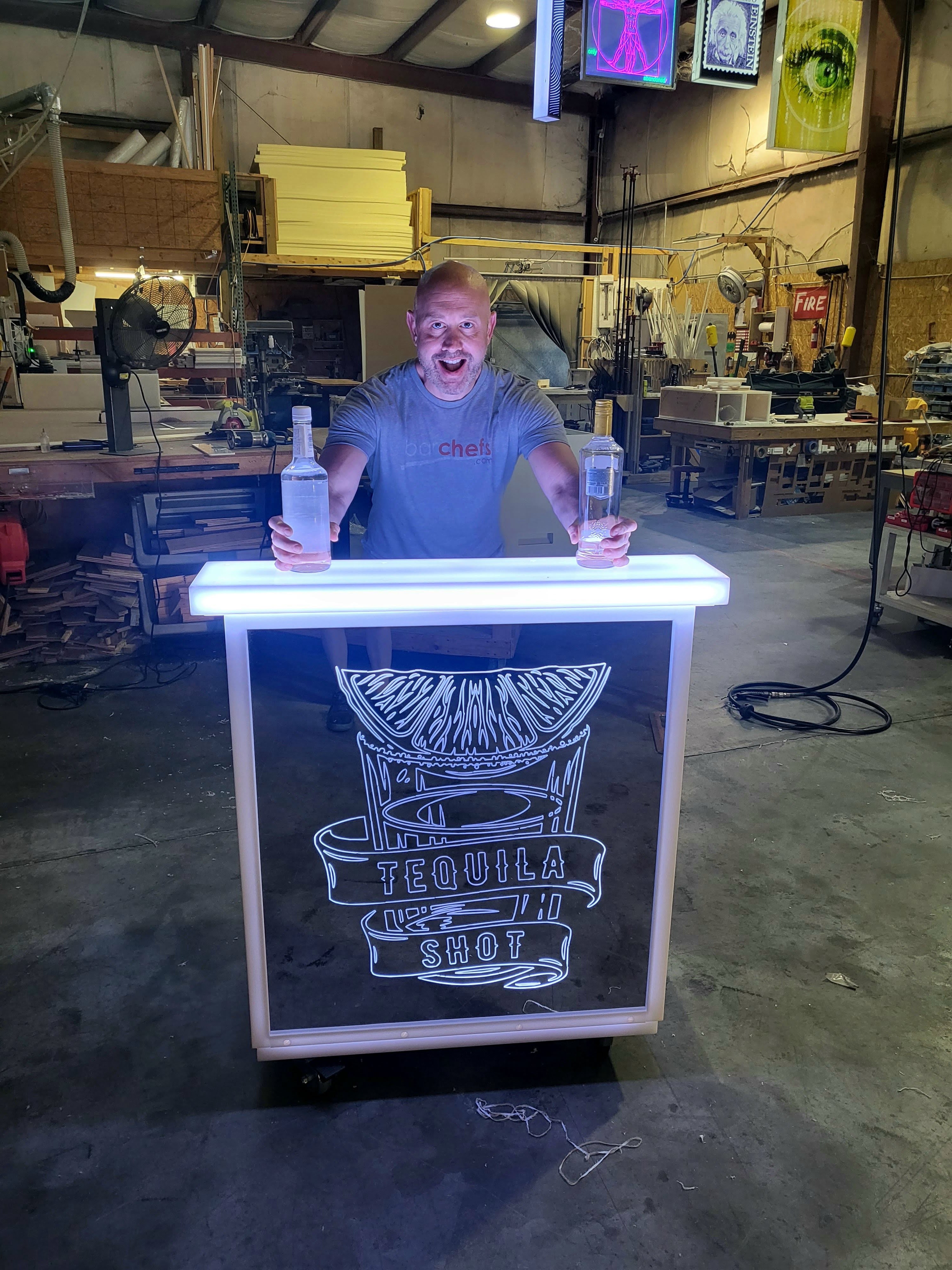 Holding some liquor bottles on top of LED portable bar