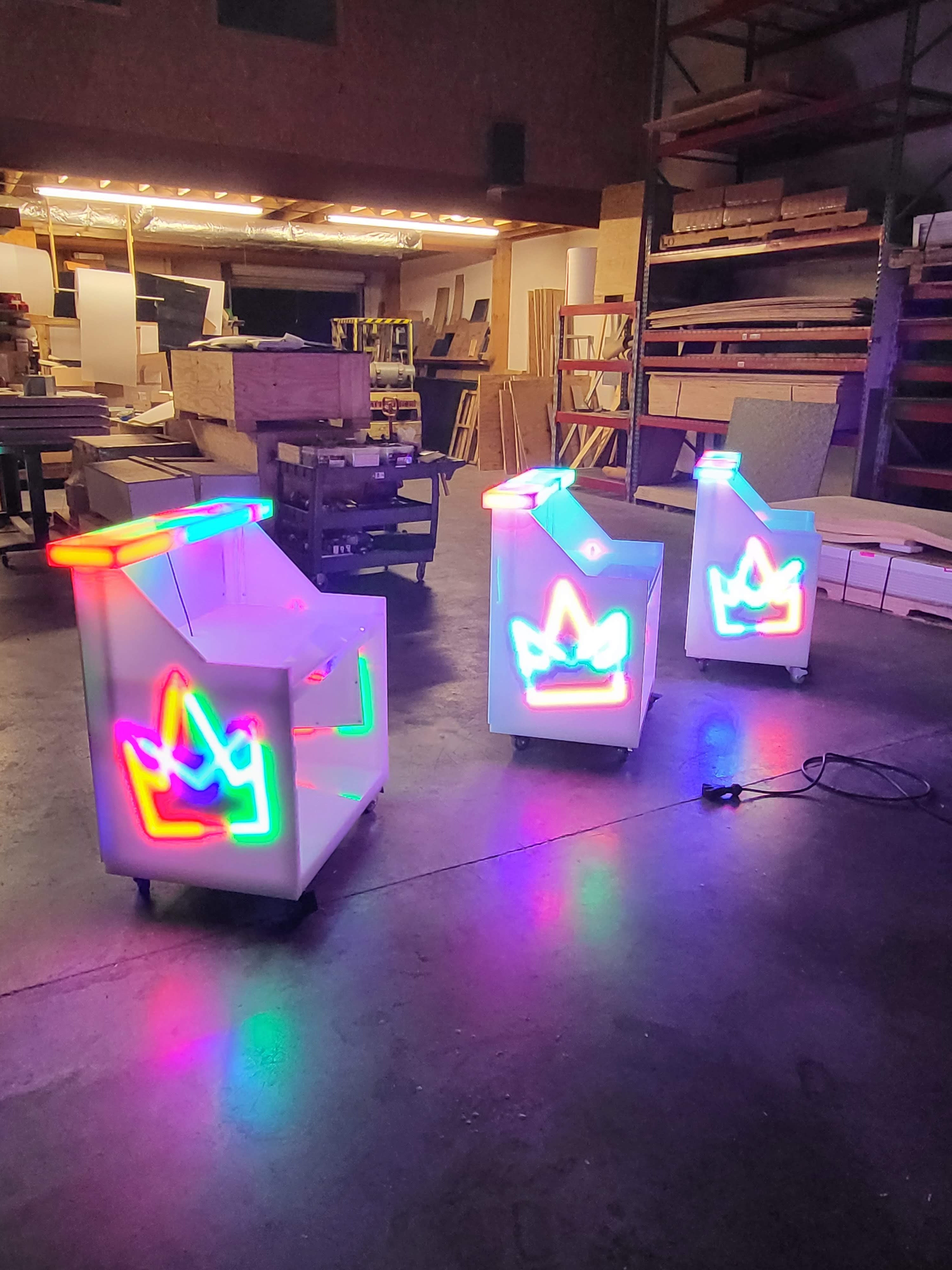Side views of LED bars with glowing crown graphics